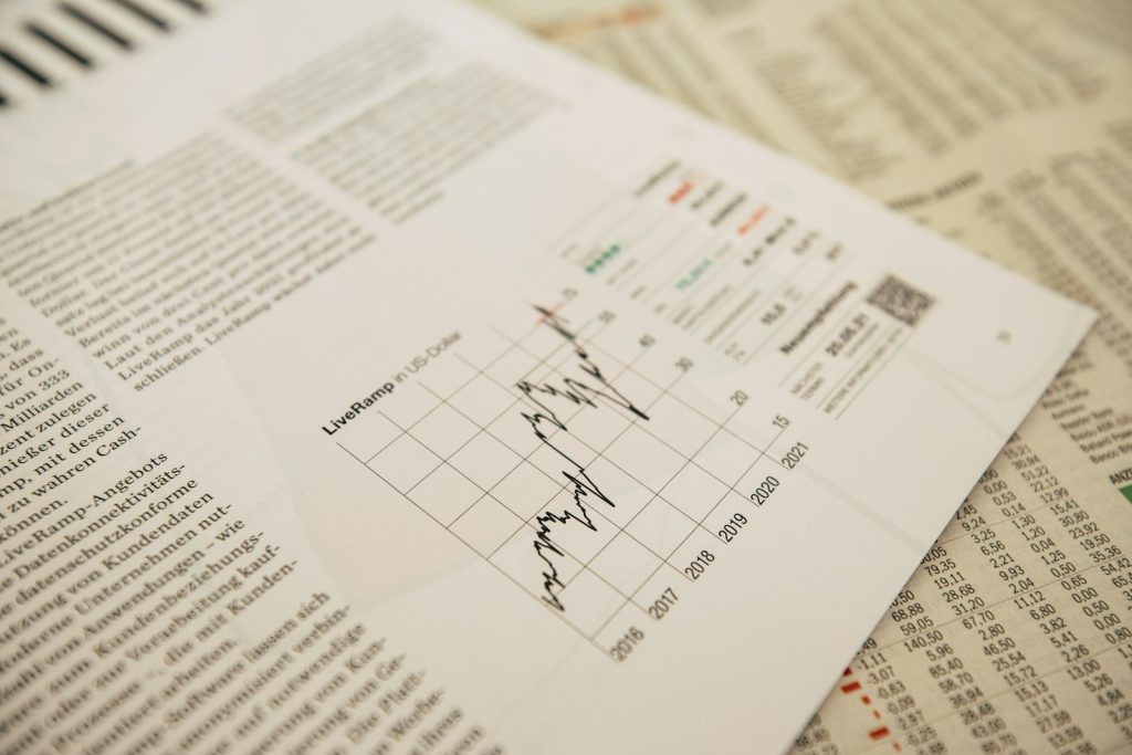 financial newspaper with stock chart